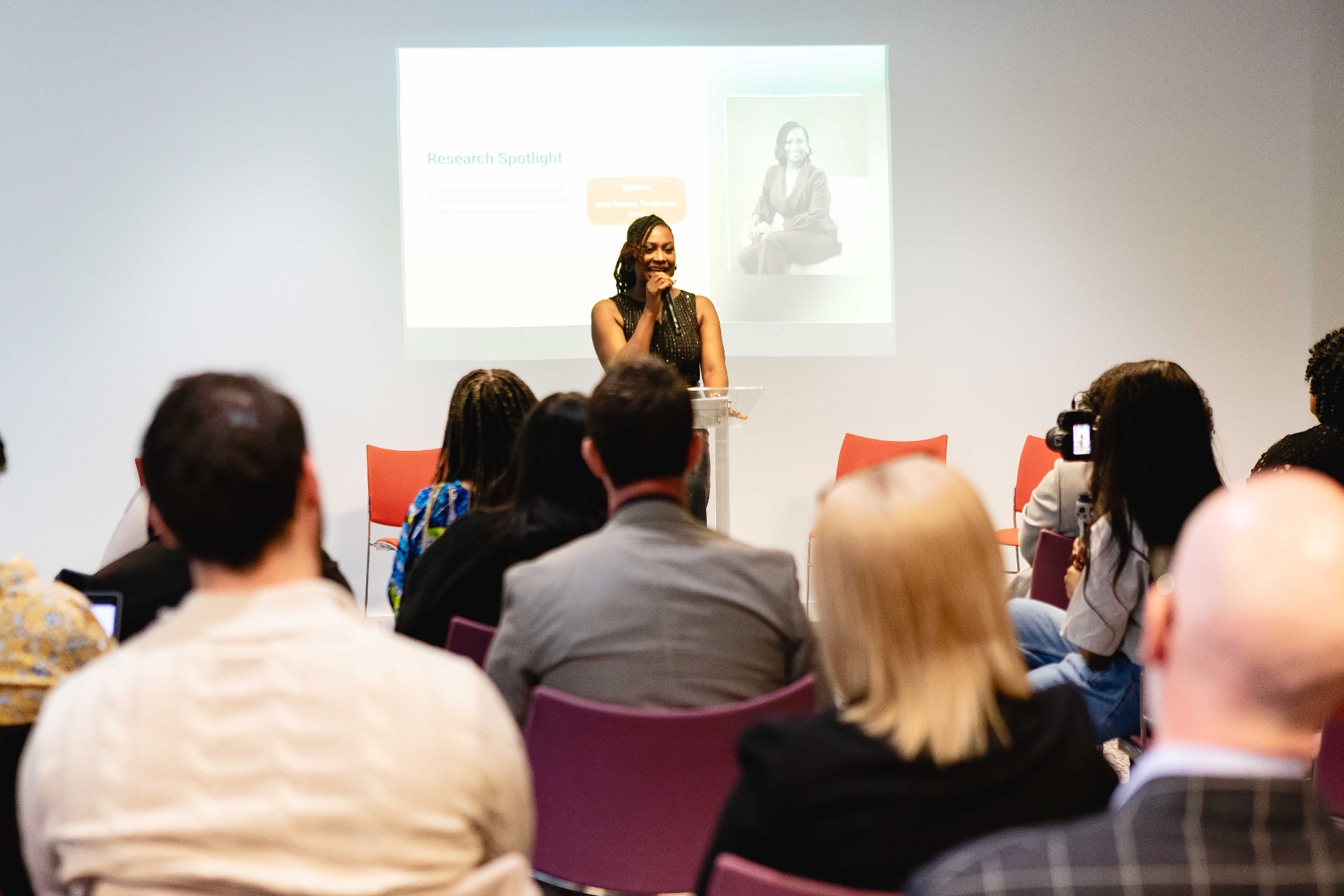 Mary Fashanu speaking at a leadership event with audience